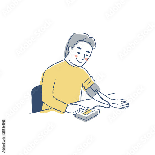 血圧計を使って血圧を測定するシニア男性