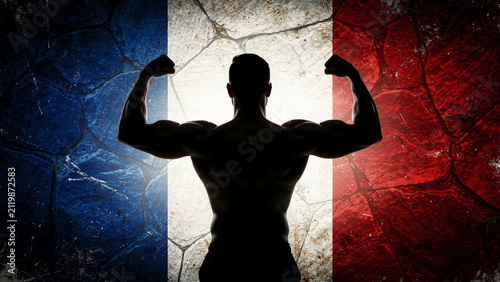 Muscular man flexing biceps against a distressed French flag background. Silhouette of bodybuilder showing strength and power on stone texture. France pride and fitness concept for sports marketing.