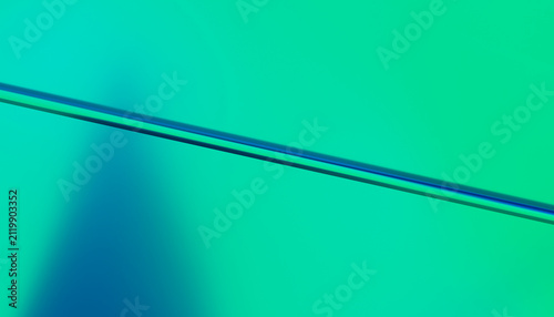 Abstract digital rendering with a diagonal blue line on green gradient