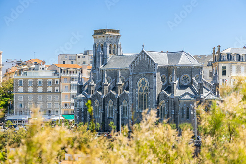 High-angle view of the grand stone structure and slate roof of Église Sainte-Eugénie in Biarritz, France