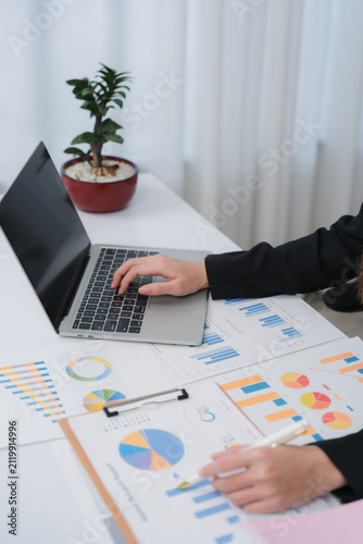 Business financing accounting banking concept. Business woman hand doing finances and calculate on desk about cost at home office. Woman working on desk with using calculator, finance accounting.	