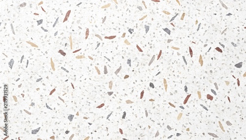 Terrazzo flooring surface with white background and scattered multi-colored stone chips