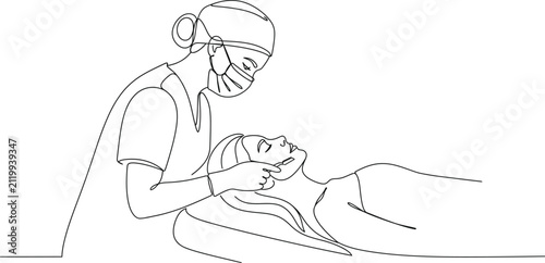 A Professional Aesthetician Performing A Dermaplaning Facial Treatment On A Relaxed Client