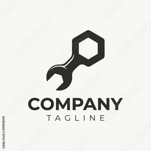 Industrial wrench and hexagon nut logo.
