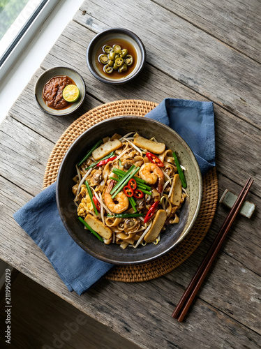 Savory stir fry noodles char kuey teow dish preparation