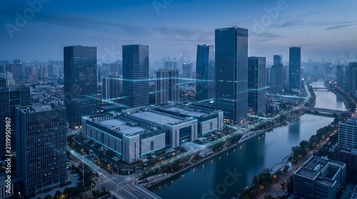 Skyscrapers overlook a river during the blue hour in a large city center.