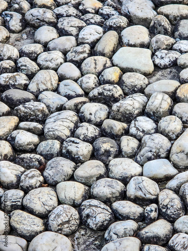 Texture of smooth river stones and white marble pebbles.