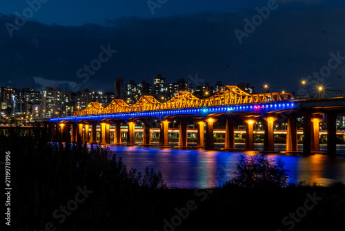 Bild auf Leinwand Illuminated bridge over Han River at night in Seoul, South Korea