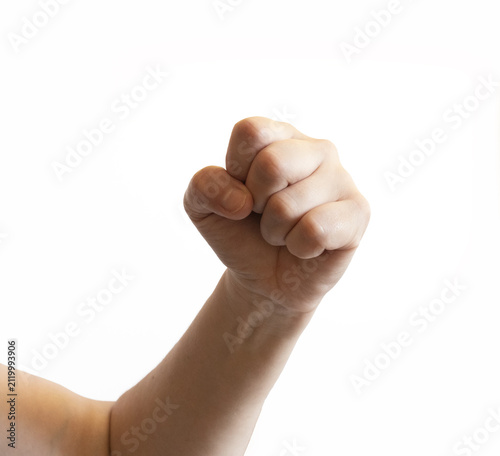 Human hand forming a raised closed fist on a white background. The gesture shows strength, confidence, or determination.