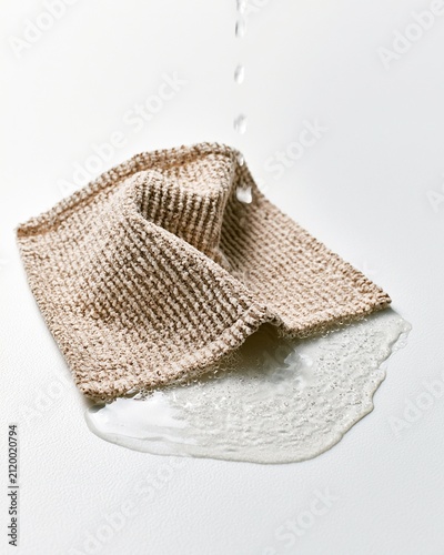 Textured Cleaning Cloth Soaking Up Water Spill