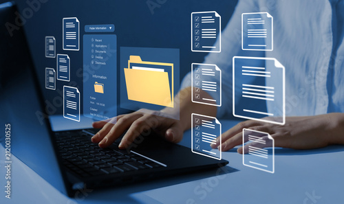 Process automation to efficiently manage files. Businesswoman working on laptop with virtual screen. Online documentation database and document management system concept.	