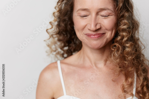Fotografie Authentic beauty of a middle aged woman with natural skin without retouching