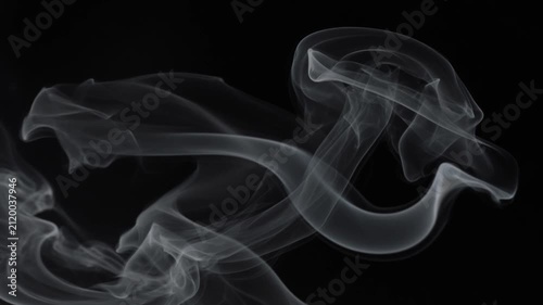 White abstract smoke plumes swirling dynamically against a solid black background