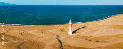 Panel kuchenny z motywem Fangar Lighthouse on sandy Mediterranean coastline with rolling dunes in the Ebro Delta aerial view