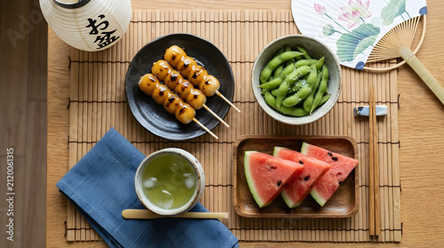 Traditional japanese summer food spread including dango skewers edamame and watermelon with japanese watermelon traditional chopsticks gastronomy delicious