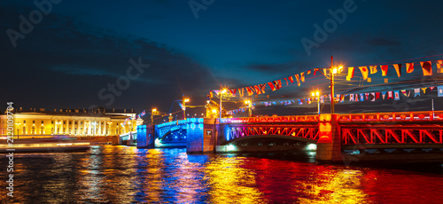 Palace Bridge in the colors of the Russian flag at night. Navy Day celebrations. Banner.