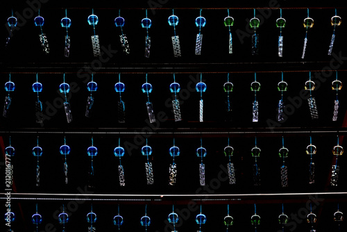 Fotografie Rows of Blue and Green Japanese Wind Chimes Illuminated on a Summer Night