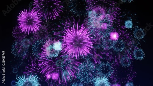 Purple and Blue Fireworks Bursting Against Black Background