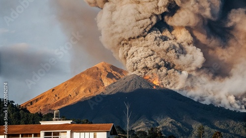Spectacular volcanic eruption. Huge boulders are thrown from the ash cloud. Mount Danau Toba Volcano Eruption Berastagi Karo, Medan, Indonesia.
