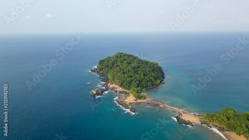 Принти на полотні Beautiful view of Bom Bom Beach on Príncipe Island, São Tomé and Príncipe, featuring golden sand, gentle waves, crystal-clear Atlantic waters, lush palm trees, and the iconic offshore islet