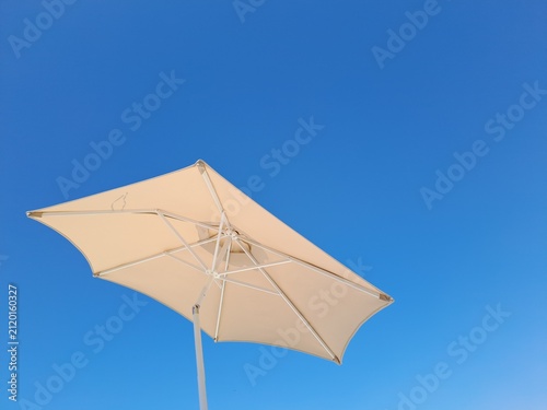 beach umbrella on blue sky