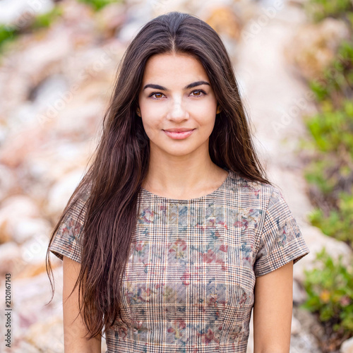 Portrait of a young woman, beautiful village girl in a linen dress