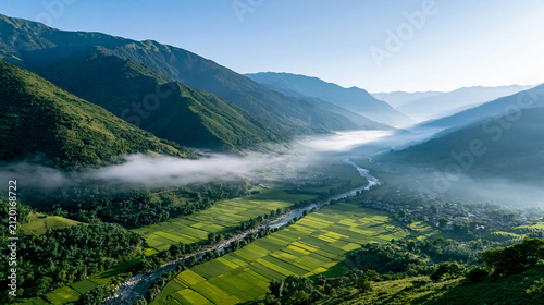 Scenic mountain valley with winding river and morning mist, tranquil nature travel destination, with copy space