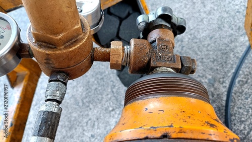 Aircraft tire nitrogen servicing equipment featuring high-pressure nitrogen cylinders and precision pressure regulator mounted on a ground support cart during aviation maintenance