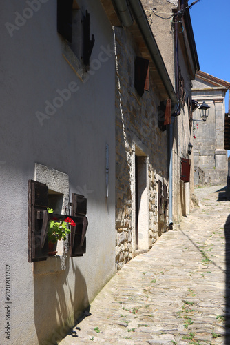 Historical architecture and beautiful landscape in the picturesque Mediterranean street in Hum, Croatia. Hum is known as 'smallest town in the world'.