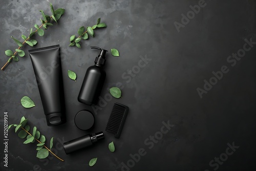 Black skincare packaging set on dark textured background with leaves skincare cosmetics products container wellness background minimalist eucalyptus botanical packaging grooming essential