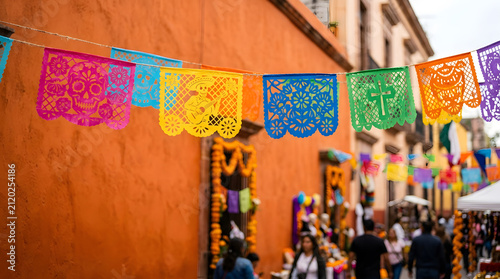 Colorful papel picado decorations hanging in vibrant street during festival  