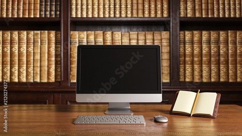 Home Office Desk Setup with Computer, Books and Notebook