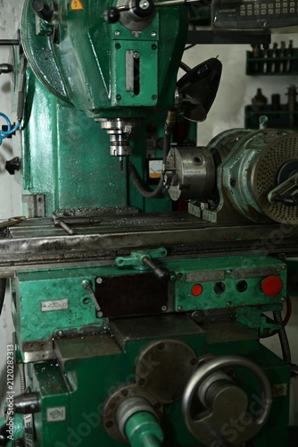 A professional metal drilling lathe in a production workshop.