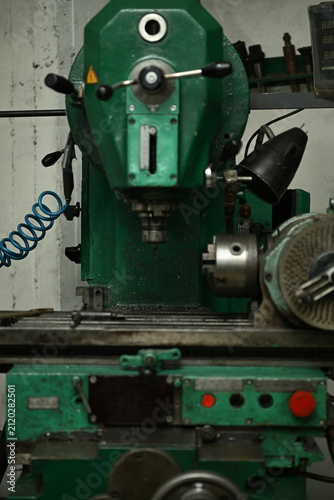 A professional metal drilling lathe in a production workshop.