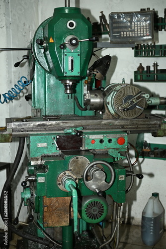 A professional metal drilling lathe in a production workshop.