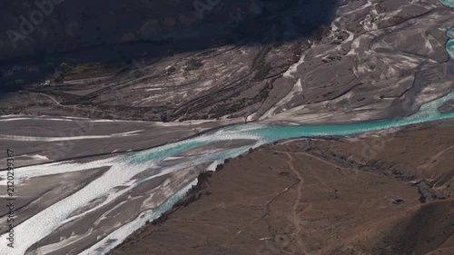 Confluence of the River Pin and River Spiti as seen from the top of the Dhankar Monastery in Spiti Valley, Himachal Pradesh, India. River flowing through a mountain valley. Dramatic nature background.