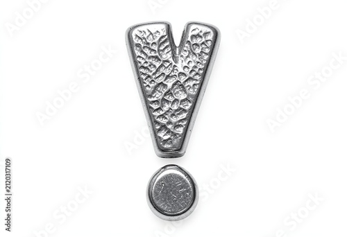 A decorative metallic exclamation mark isolated on a white background with intricate floral pattern details
