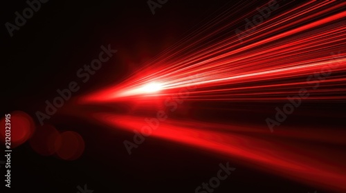 Bright red light beam flares across a dark background with bokeh