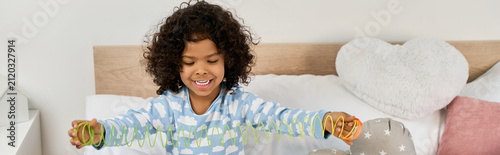 фотографія Joyful moments of a young boy playing indoors in a stylish apartment