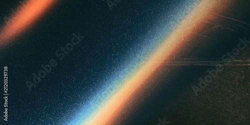 Abstract light streaks in a dark, dusty, textured atmosphere