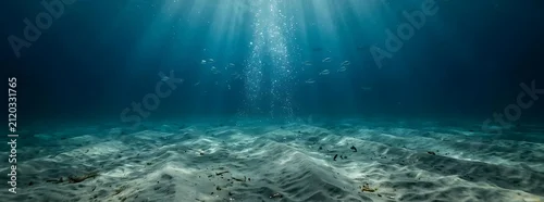 Panel kuchenny z motywem Sunlight rays shining through deep blue ocean water