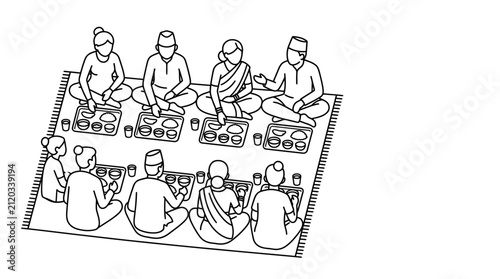 A group of people sitting on the floor eating a traditional meal together.
