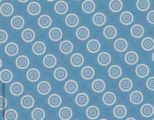 Grey geometric circular sunburst patterns with blue background and white speckled dots. Suitable for design projects, print materials, and web backgrounds.