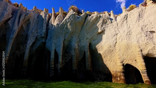 Vibrant sunset light glows over the famous Crowley Lake Stone Columns in California