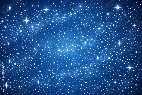 Vast expanse of blue starry night sky with twinkling stars and nebulae