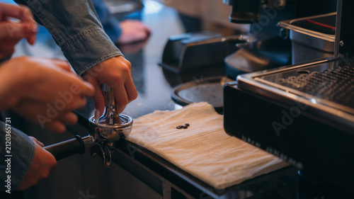An experienced instructor guides students through the art of coffee making in a barista class, demonstrating brewing techniques and sharing tips for crafting the perfect cup