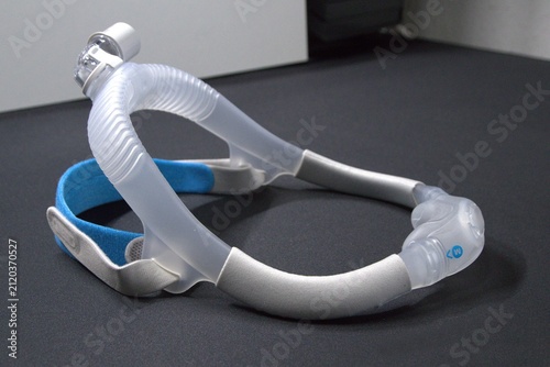 New nasal CPAP mask or new nasal CPAP cradle cushion improves sleep apnea disorder therapy and sleep comfort. Sleep apnea and sleep disorder with snoring stopped by respirator mask CPAP machine.