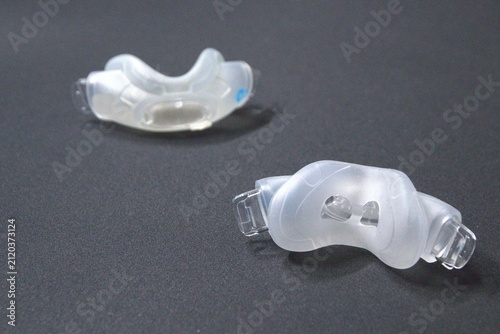 Old nasal CPAP mask or old nasal CPAP cradle cushion needs replacement for hygienic sleep apnea disorder therapy. Sleep apnea and sleep disorder with snoring stopped by respirator mask CPAP machine.