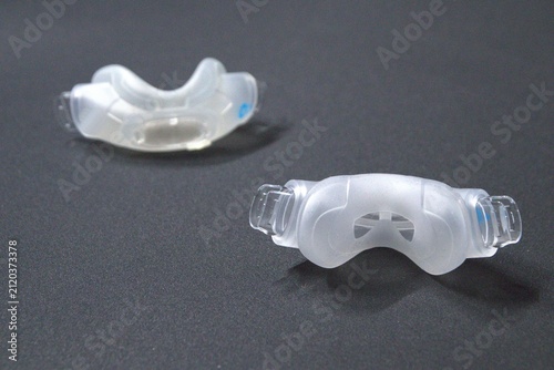 Old nasal CPAP mask or old nasal CPAP cradle cushion needs replacement for hygienic sleep apnea disorder therapy. Sleep apnea and sleep disorder with snoring stopped by respirator mask CPAP machine.