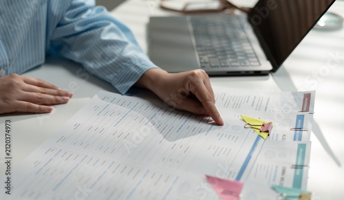 Bild auf Leinwand Human resources professional reviewing resume and job application documents for candidate selection
